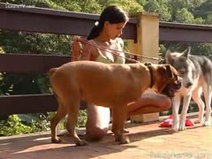 A girl in the terrace garden swallows two knobs.